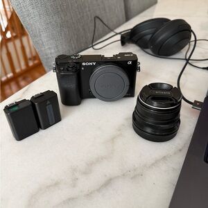 Sony Black Mirrorless Camera with Lens and Accessories